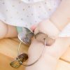 Child holding Kleynimals Rattle - detail 2