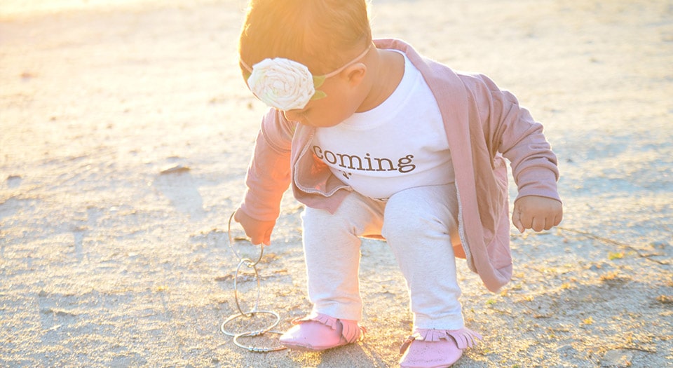 Baby on beach with Kleynimals Jangles