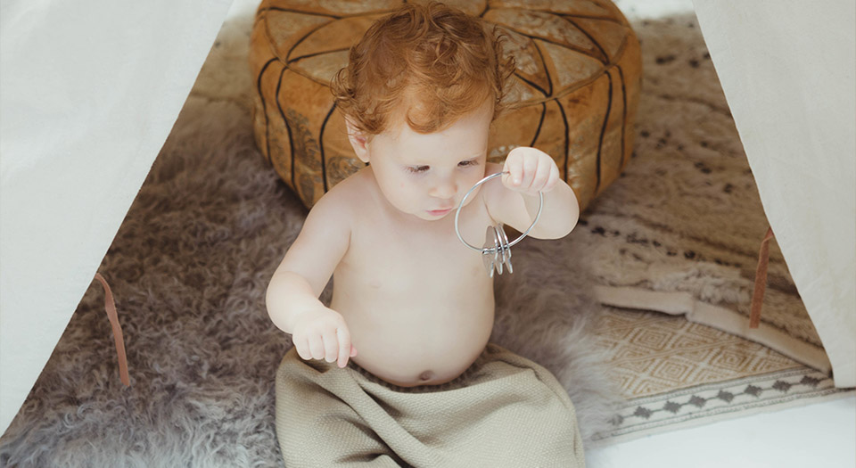 Baby in tent with Kleynimals Rattle