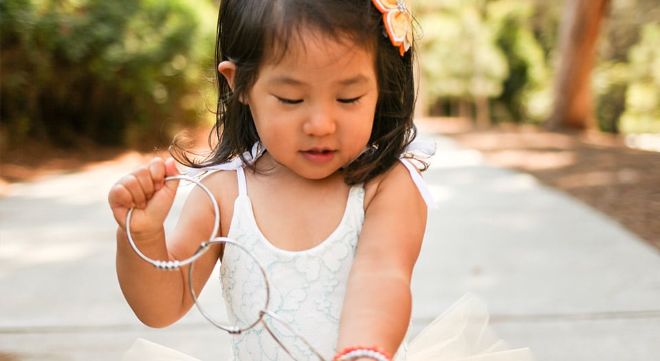 Little girl playing with Kleynimals Jangles